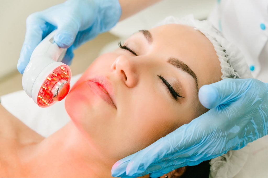 Woman getting an infrared facial