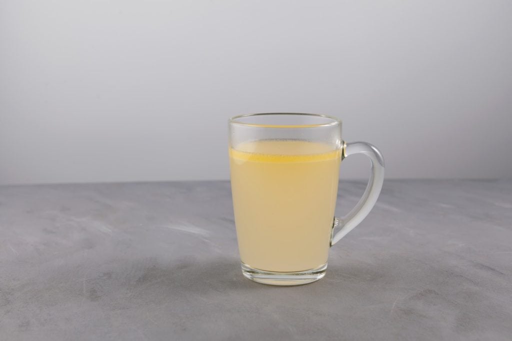 Bone broth fast: homemade beef bone broth in a glass