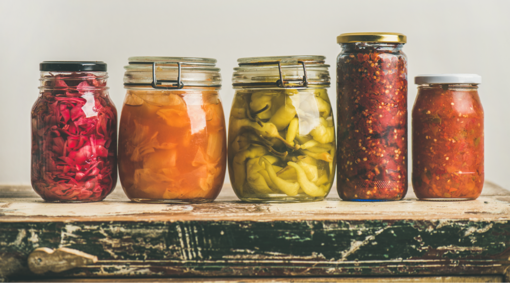 Digestive enzymes vs Probiotics: Fermented vegetables in jars