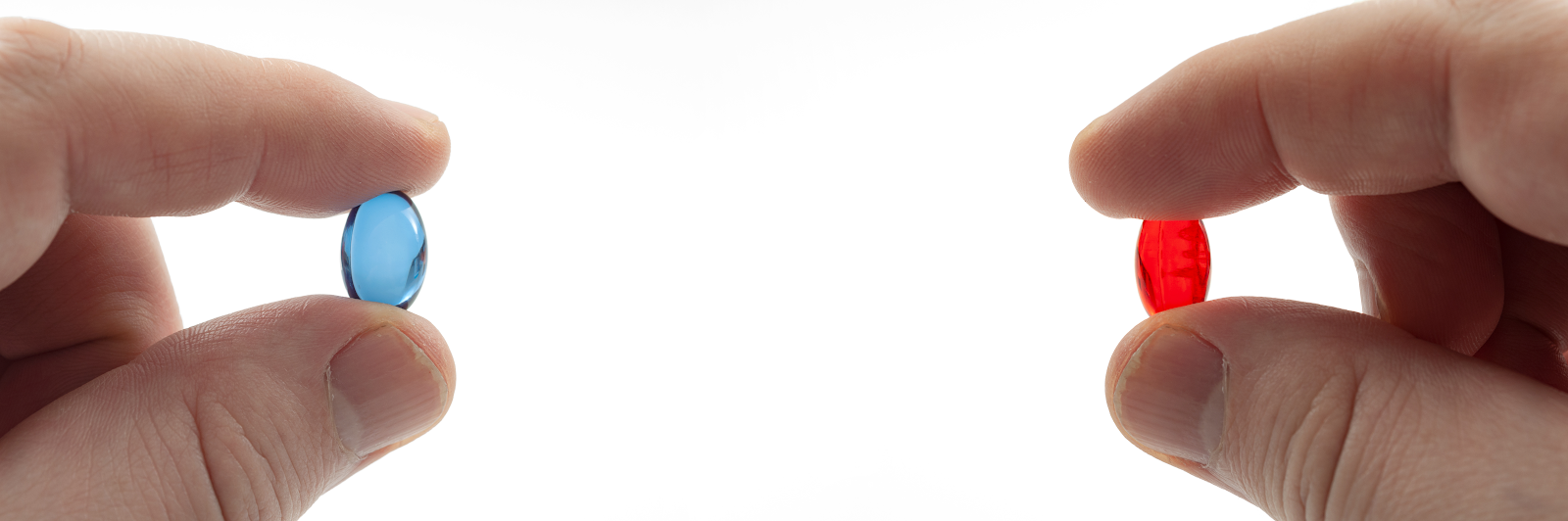 Digestive enzymes vs Probiotics: Two hands holding red and blue pills