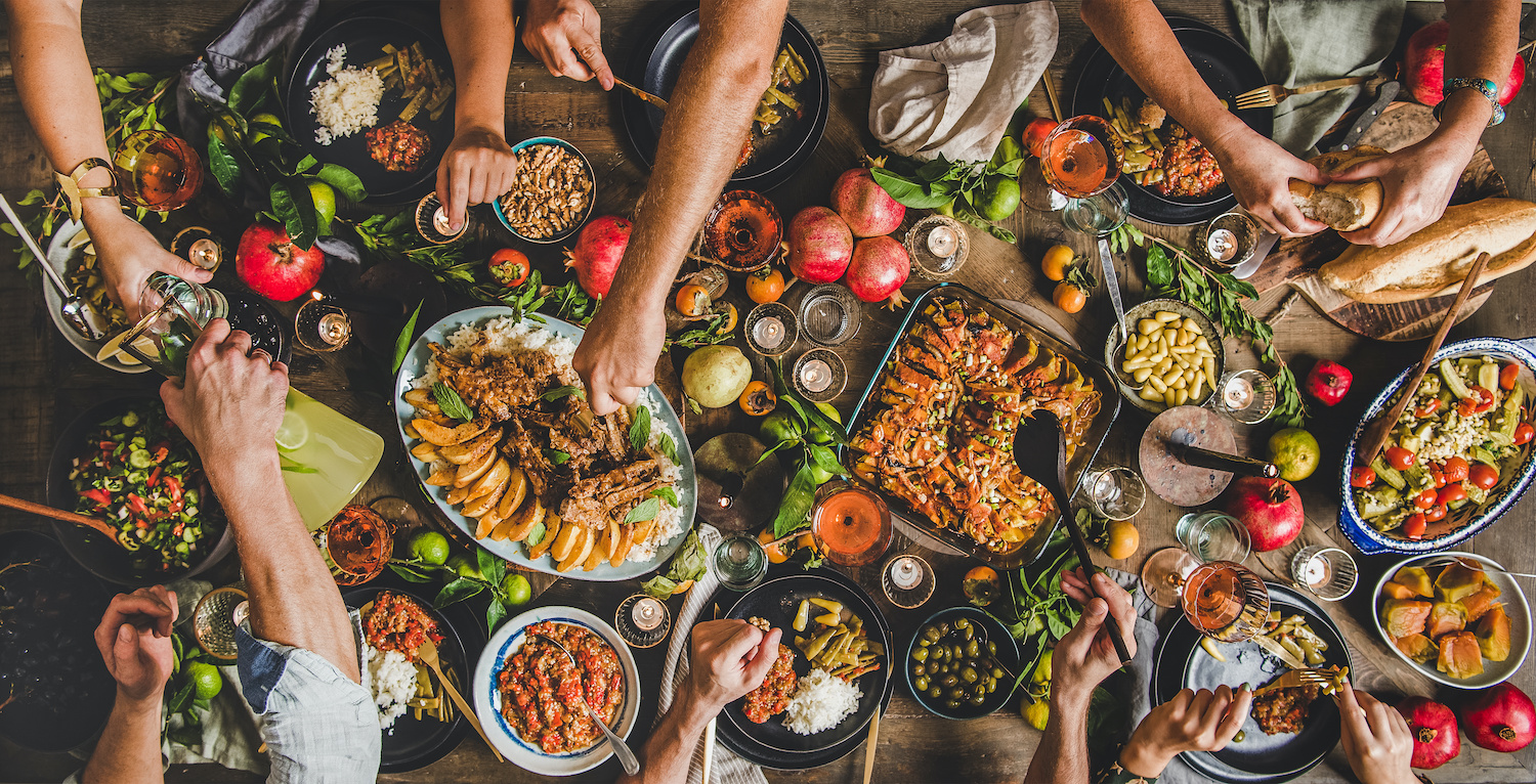 Gut healing diet: Group of people having a food feast