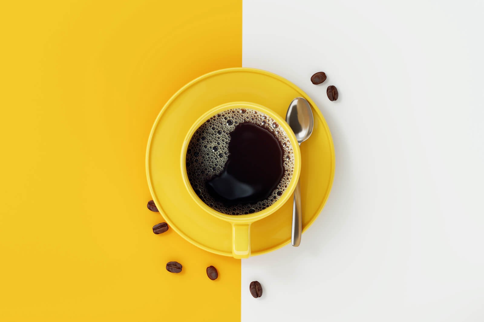 benefits of black coffee: top view of coffee in a yellow coffee cup