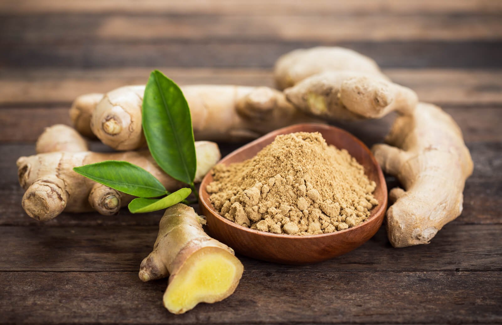 Prokinetic drugs: ginger root and ginger powder in a bowl