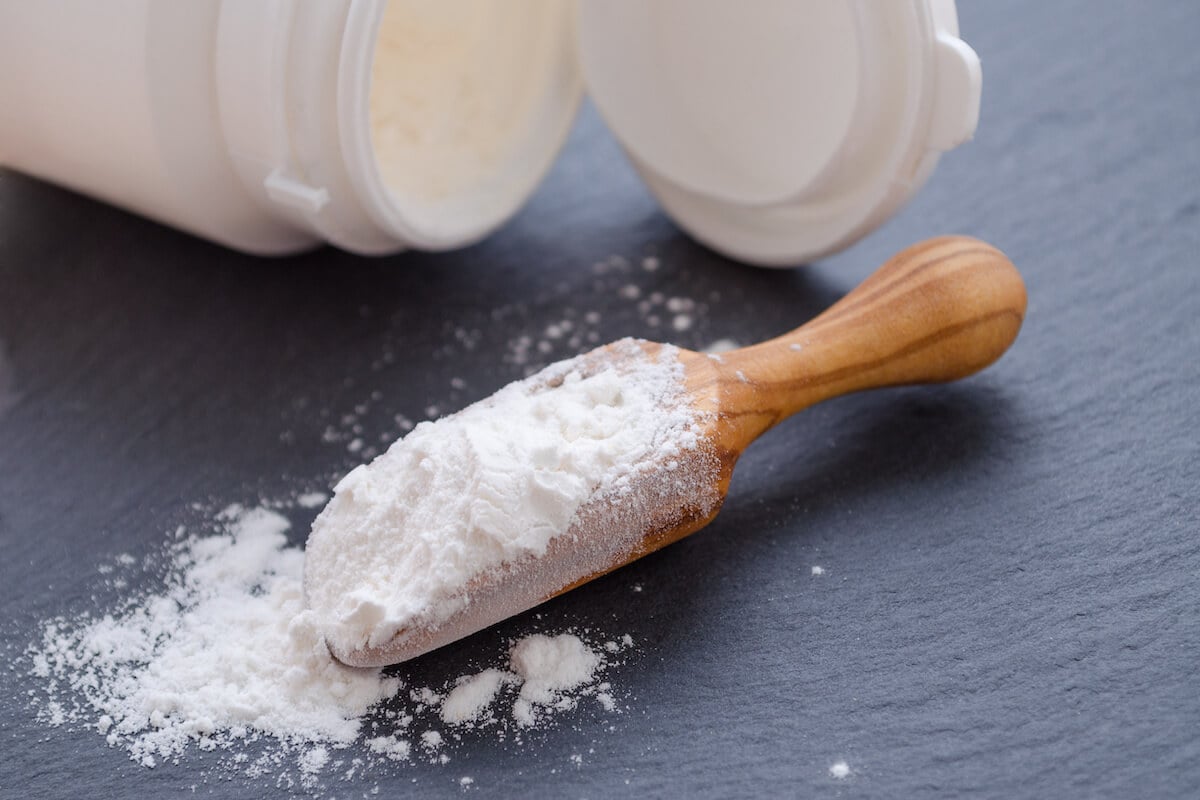 Best prebiotic supplement powder on a wooden scoop