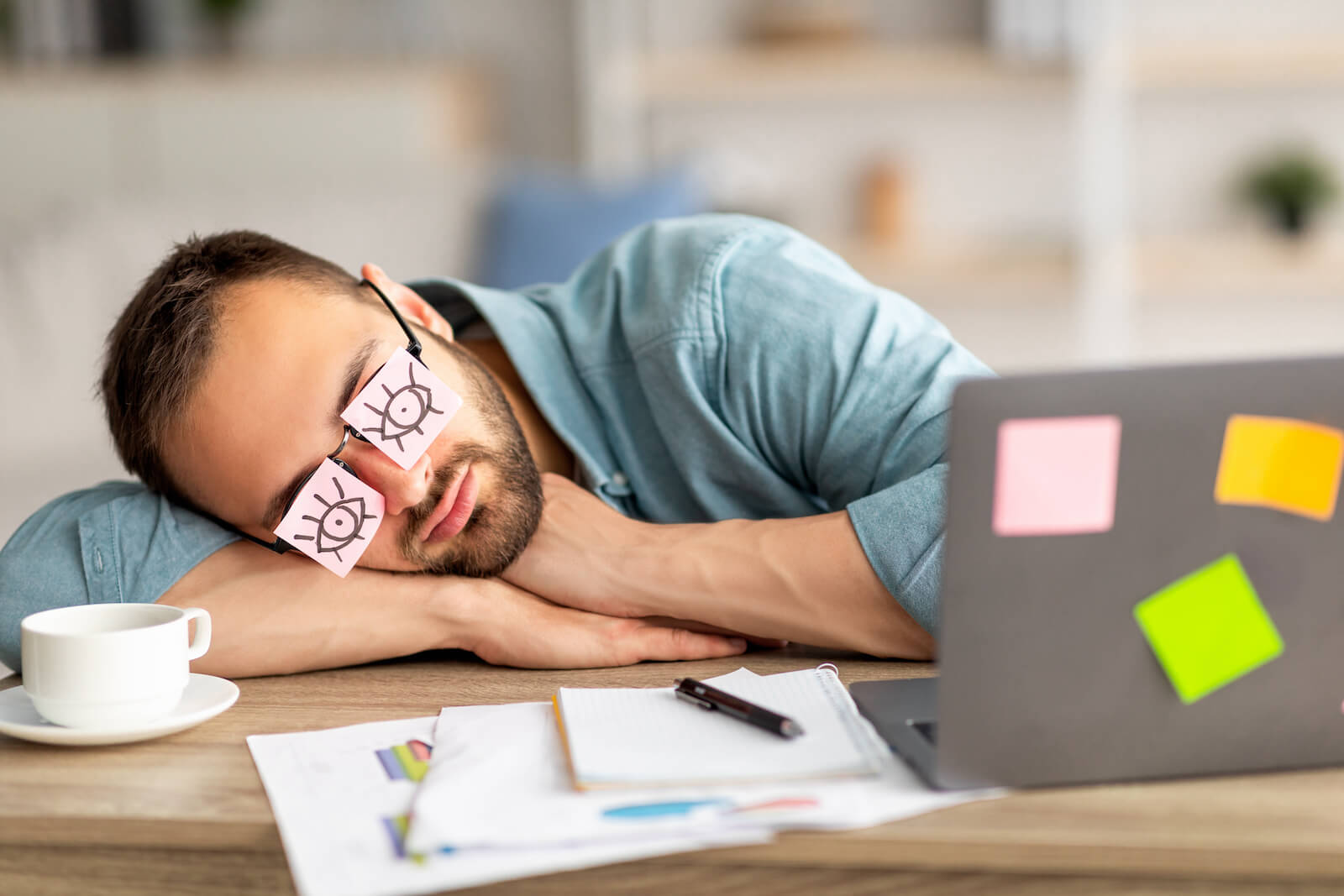 Sleep vitamins: man sleeping at work
