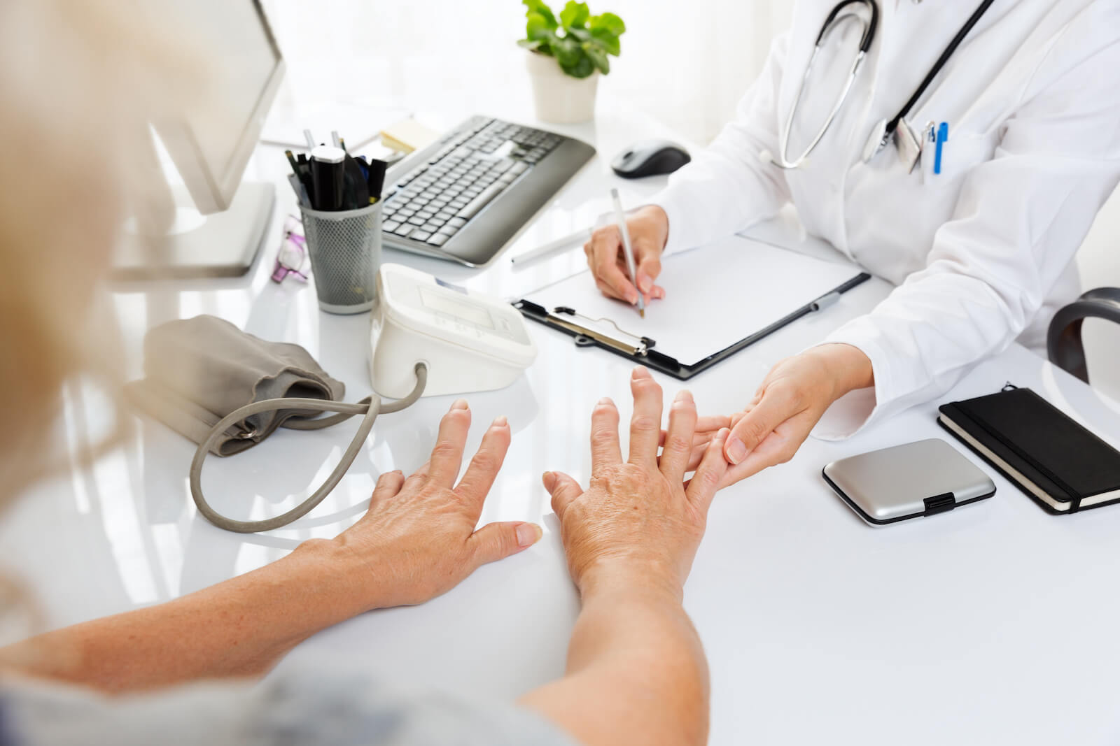Doctor examining a patient's hand