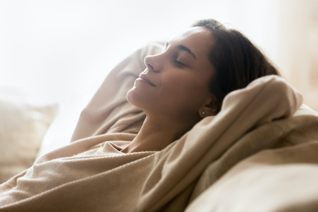 Young woman relaxing on a couch