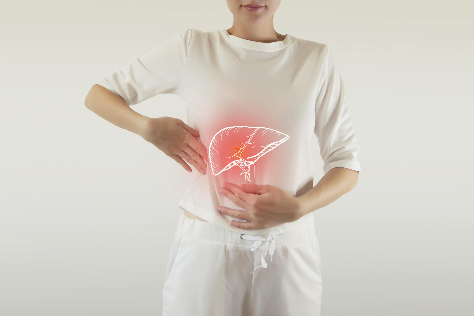 Liver illustration on top of a woman touching her stomach