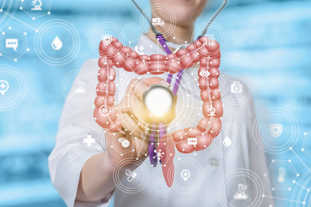 Autoimmune skin disease: doctor using a stethoscope on an intestine hologram