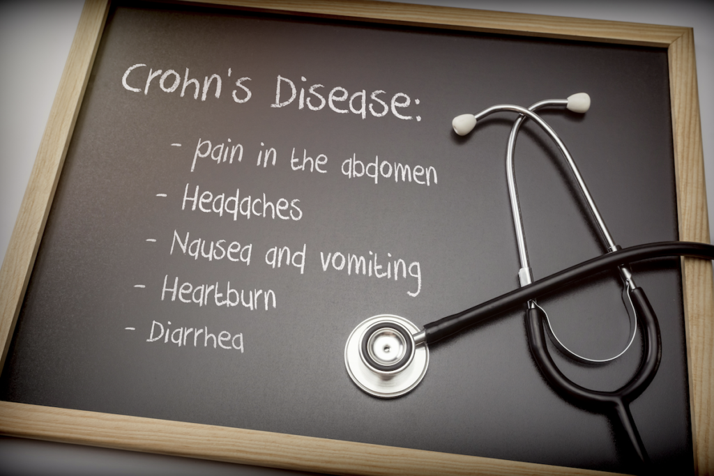 Crohns disease treatment: Crohn's disease symptoms written on a blackboard