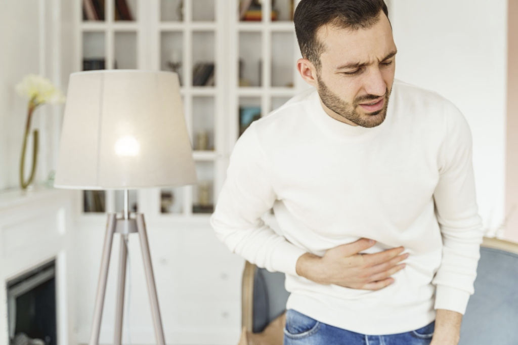 colitis treatment: Man with an aching stomach