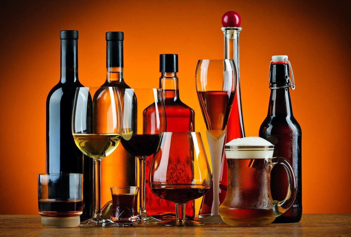 what 3 foods are bad for your gut: Different types of alcoholic drinks in bottles and glasses