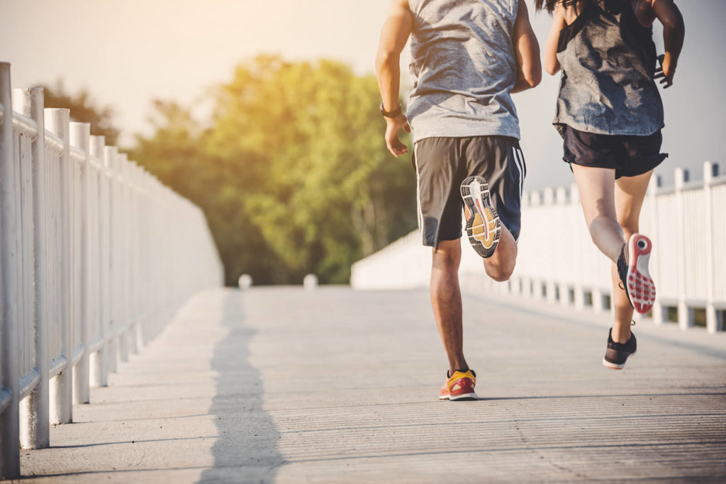 Cardiorespiratory fitness: couple running outdoors