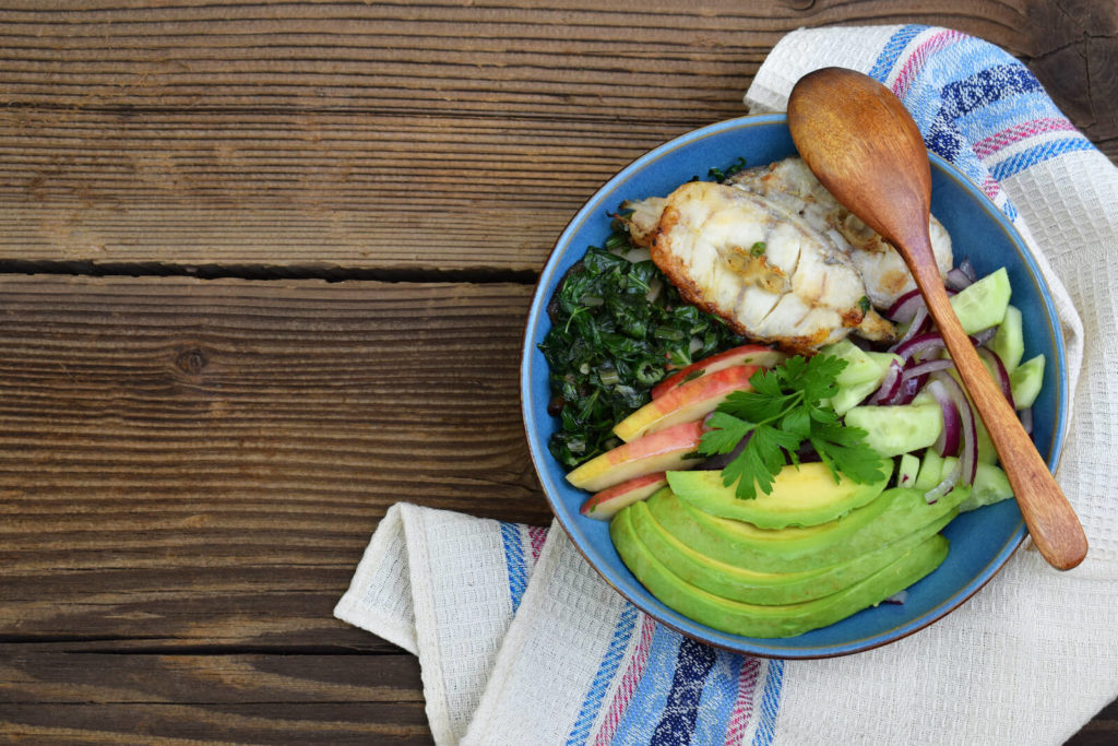 Fish with salad in a bowl